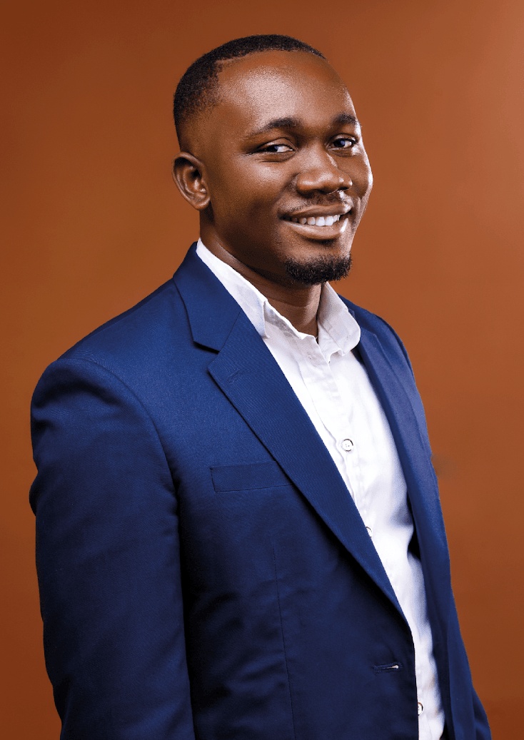 Bright Okereke in a blue suit